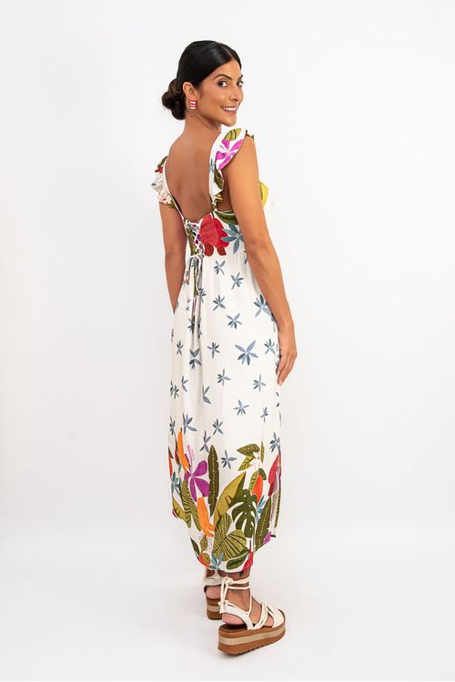 Vestido longo tropical off white — vista traseira mostrando amarração nas costas e barrado com folhagens e flores coloridas.
