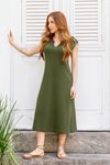 Vestido-midi-em-malha-Heritage-com-decote-V-ombro-virado-e-fendas-laterais-combinando-conforto-e-elegancia-para-looks-sofisticados-no-dia-a-dia.